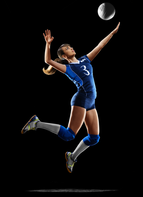 Volleyball female spiking volleball out of the air